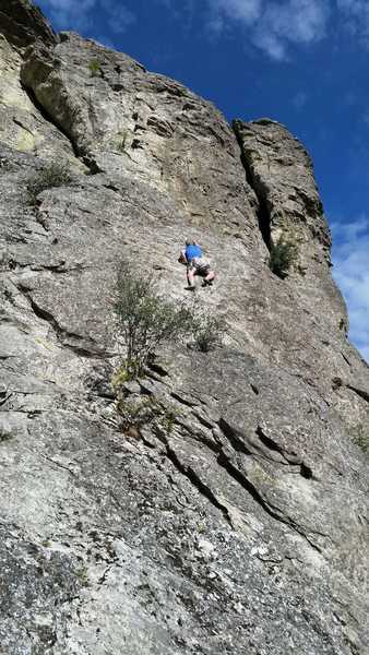 Bob Ordner working up towards the upper bolt of the crux on Satori, July 2019