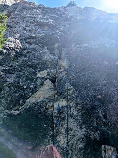 Follow the seam to the big ledge then trend left up the headwall on disjointed horizontal cracks