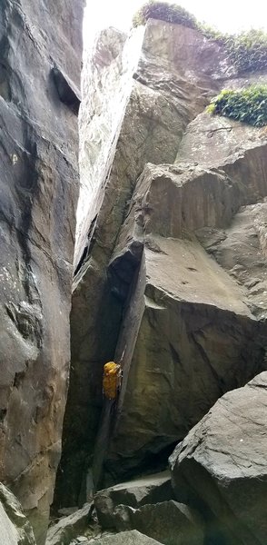 Bag's hanging on first bolt. I climbed the route up the dihedral and to the ledge, then straight up and left to the anchors under the bush.