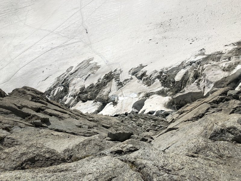 Looking down the low-angle climbing en route to the East Ridge. Broken glacier approach seen below (7/2019).