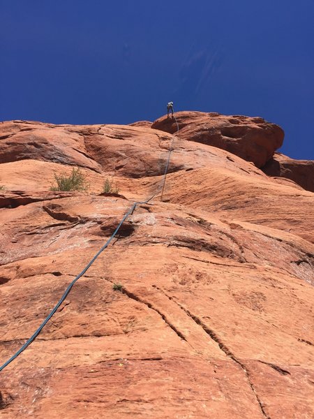 Starting the rap from the summit. You definitely need a 70m rope.