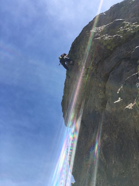 Michelle face climbing to the anchors on Mahogany Swirl.