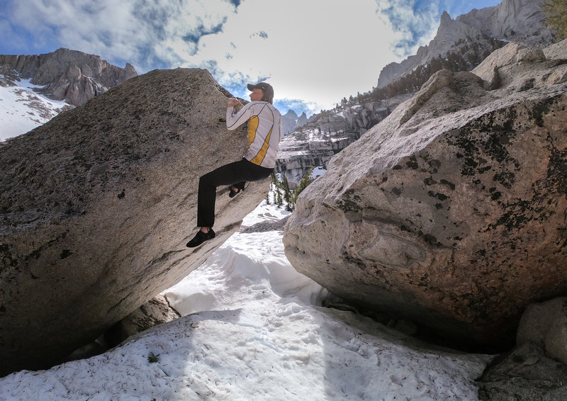 Adam pulling up the nose and prepping for the move to get the top out on the left side of the arête.