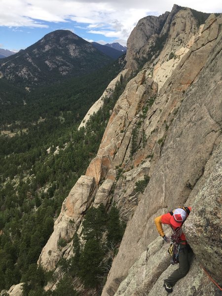 Moving right under the roof near the top of the 3rd pitch. From the route tracing pics here, it seems people bypass this roof, going right toward the left-facing corner about 20 feet lower.
<br>
<br>
Photo by Jay Patterson.