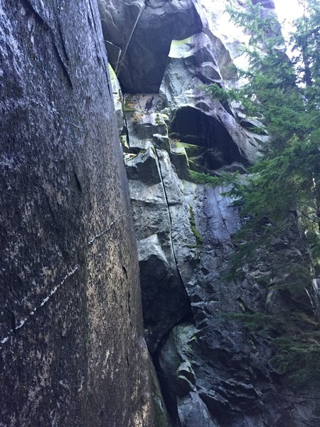This photo shows the "Thunder Crack", an optional first pitch through an overhanging hand and fist crack to bolted rap anchors.