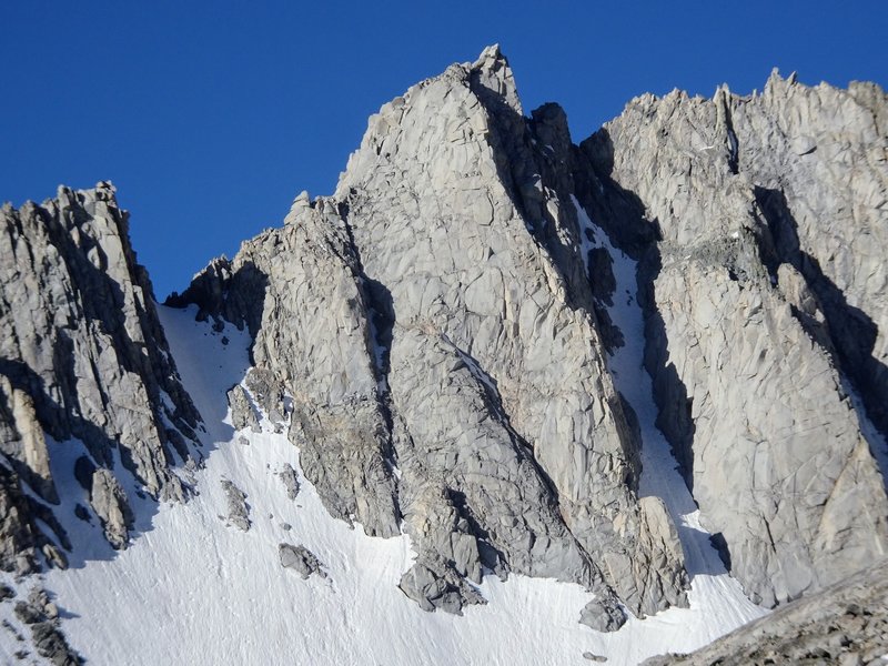 East Spire (center) and West Spire (pointy little block on right). North Arete ascends the central rock buttress, and the North Couloir is the obvious shaded gully just to the right.