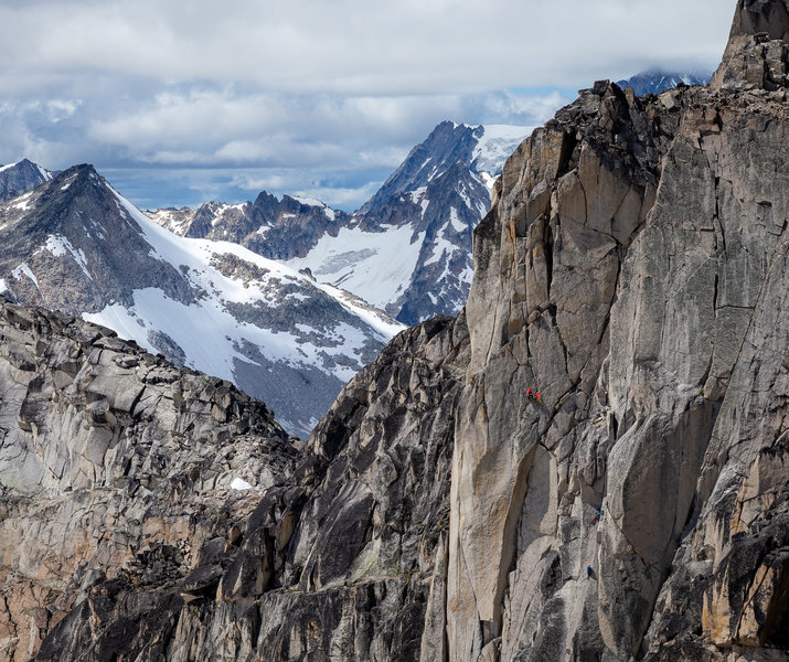 NOT the two climbers in red. The two climbers below to the right in blue.