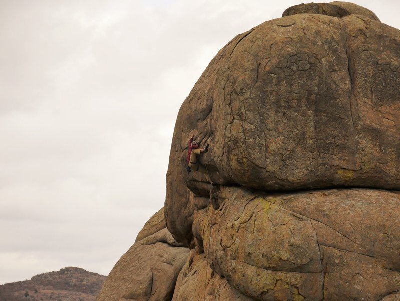 Hayden pulling the crux, throwing the right heel and pulling madly on the left hand pinch/crimp. A picture in the guide book shows Tony going right, never figured that one out...