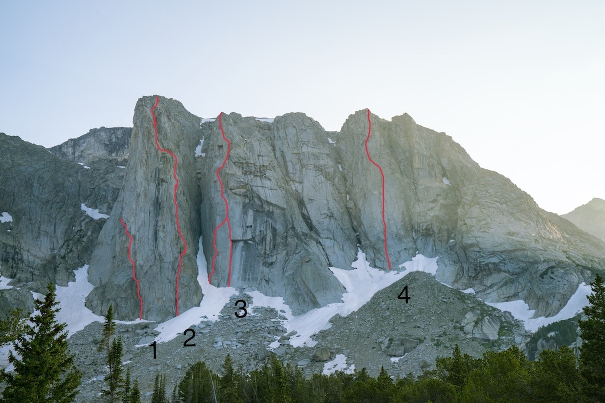 The Dog Tooth Peak massif with known routes shown. (1) An attempt we