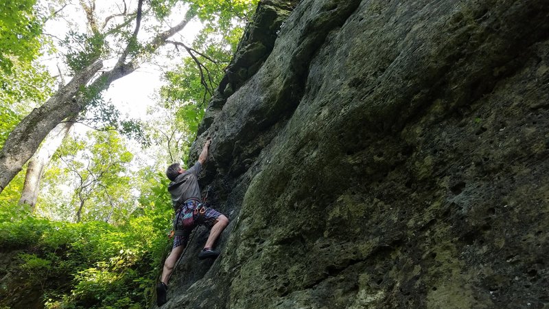Jim making his way up to the second bolt on the Mad Corner