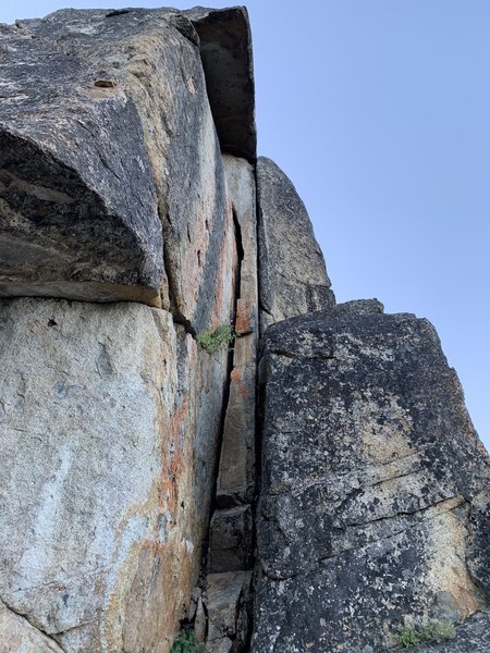 Climb the wide crack on the left. The right side crack is too dirty to climb.