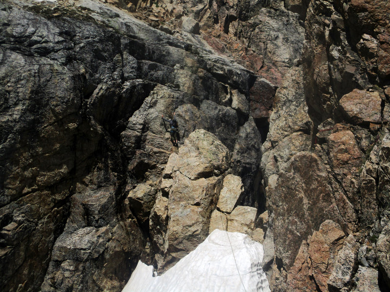 Brock starting into the 5.7 mantle crux. I found this section to be very hard for 5.7. Brock is very tall, so it was easier for him!