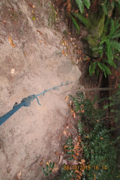 use the rope to climb the slope on the way up