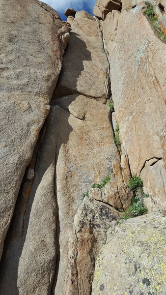 Right side of Instant Karma Cliff: the left hand/fist crack is Kundalini, 5.10c. The right corner crack is Karma Corner, 5.8.