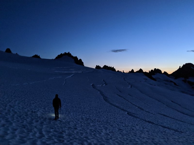 Traversing the Inspiration Glacier at dawn. Tepeh Towers on the horizon. (Photo: Erick T.)