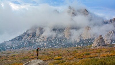 Josh Richardson standing next to the dopest camp spot in the MM's. Never Never Land in the Back ground.