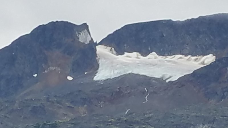 You can barely see the spire in the pass above the glacier.