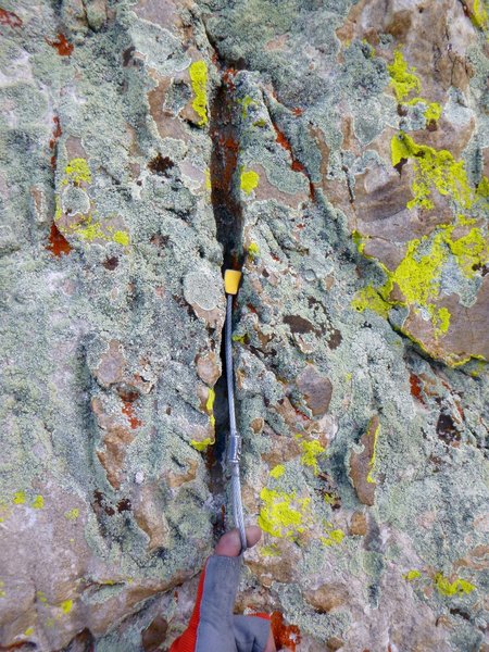 The majority of gear placements look something like this: nuts wedged into shallow vertical runnels (rillenkarren). These placements are everywhere if you keep your eyes out for them!