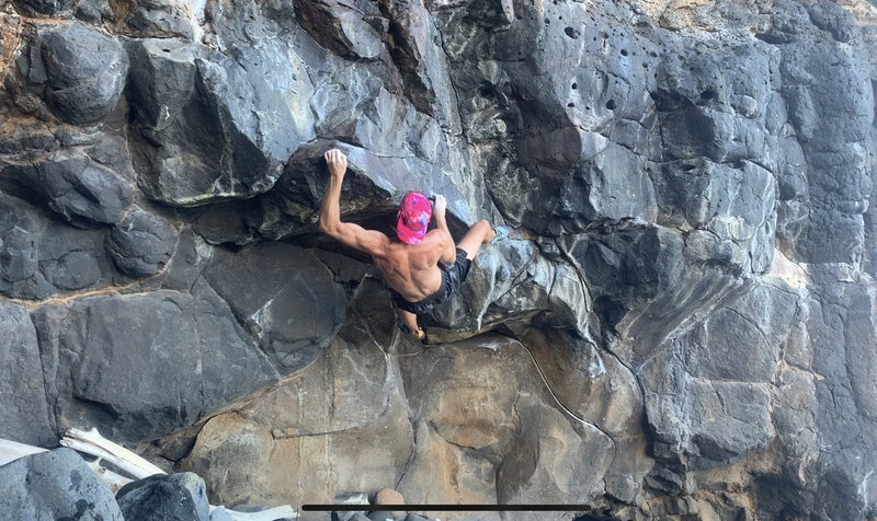 Nearing the end of "le Sabre". The climb begins down and right on the obvious angling crimp rail, then moves left to cool moves along the lip.