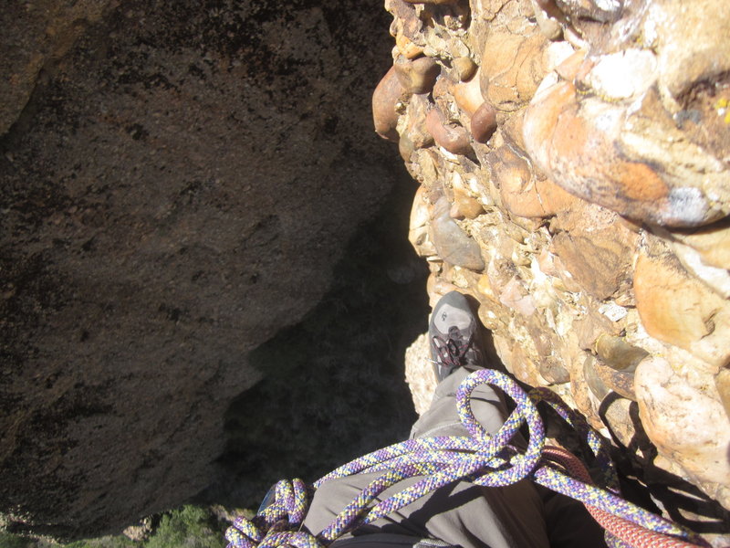 About half-way up Pitch 3. A nice comfortable cobble to rest your feet on, and then nothing else below you for 200 feet!