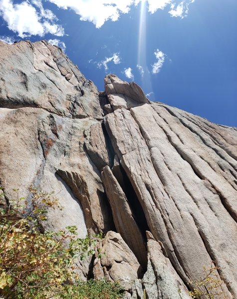 The route seen from the base. The belay atop the first pitch is on top of the leaning pillar, with the 5.7+ flaring slot directly above.