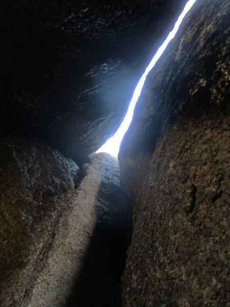 Looking up after tunneling inside. Climb up this cool triple-crack chimney to finish!