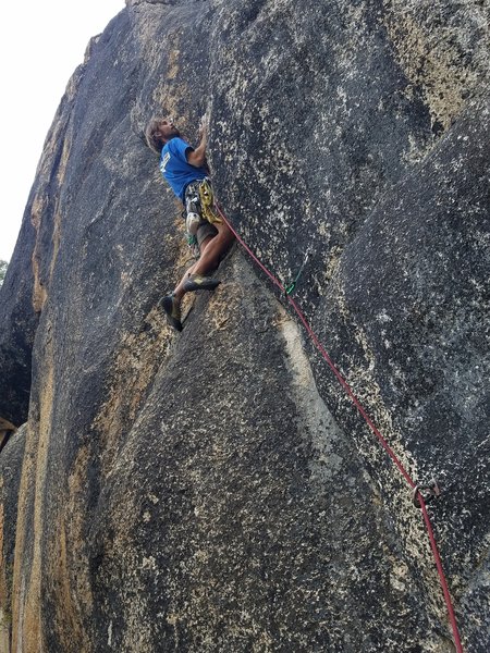 Jerome Weber grapples with the mid section of Sherman Tank, 5.11c/d.