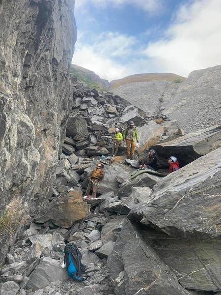 Jason Stapel snapping this great photo of climber acting like pikas underneath the Republic of Boulder.