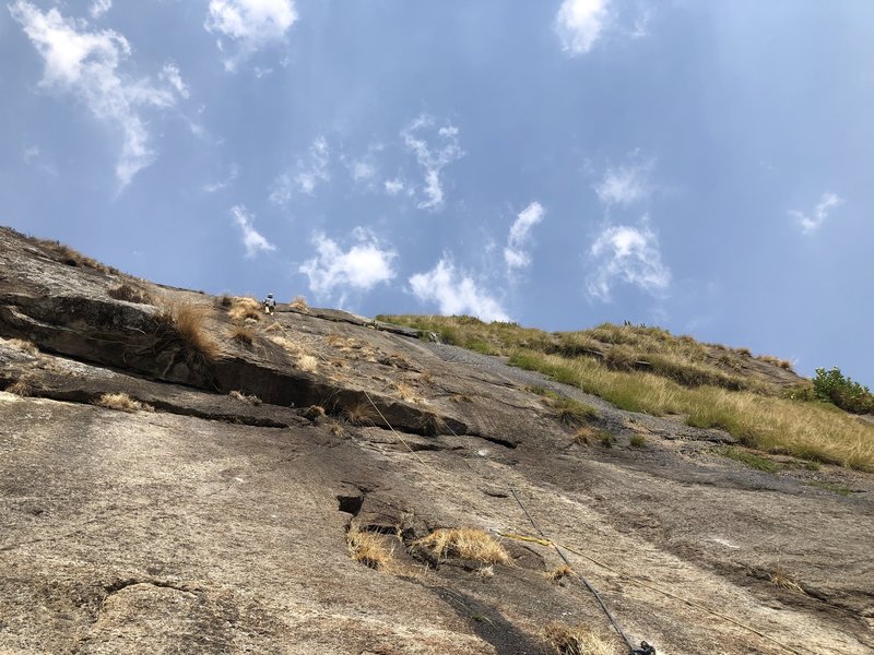 Scott resting on the fourth pitch right before taking a massive clipping fall on a slab bulge during the FA