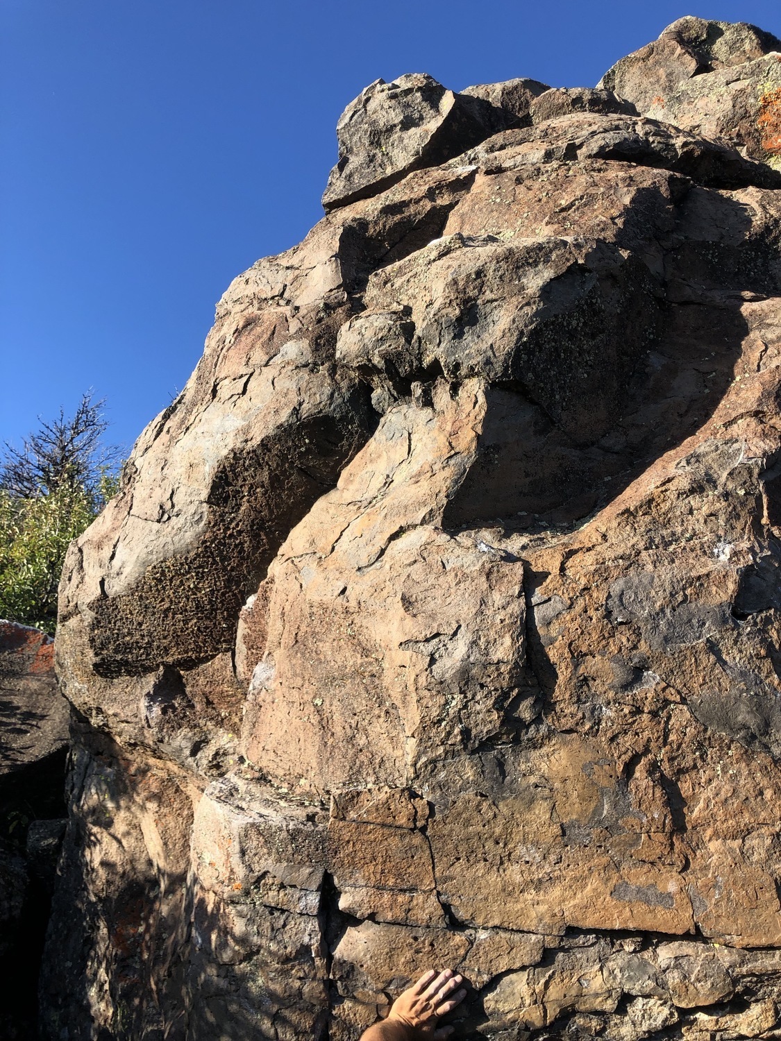 Face of the Cougar Rock Boulder as seen from the trail upon approach.