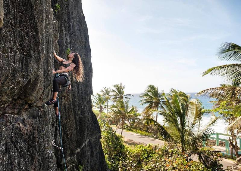 Crys climbing at Playa Puerto Hermina. Photo courtesy of Manuel Vélez (manuelvelez.com)