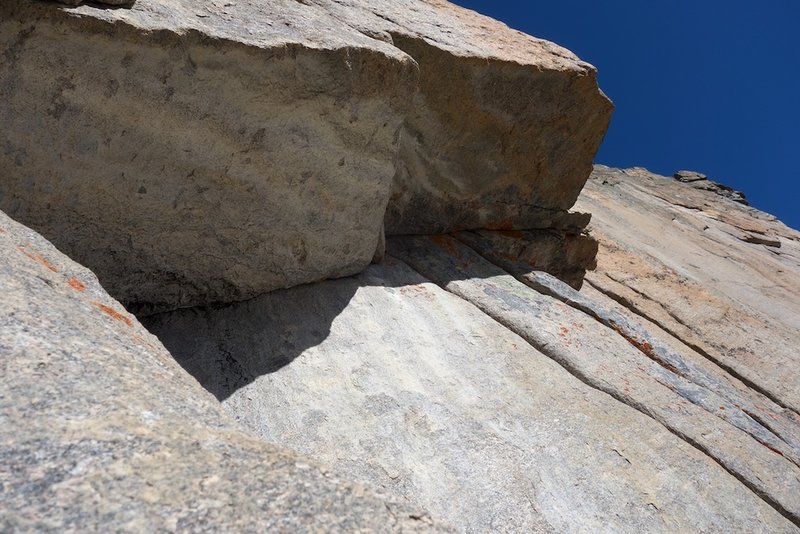 The crux roof on pitch 4.