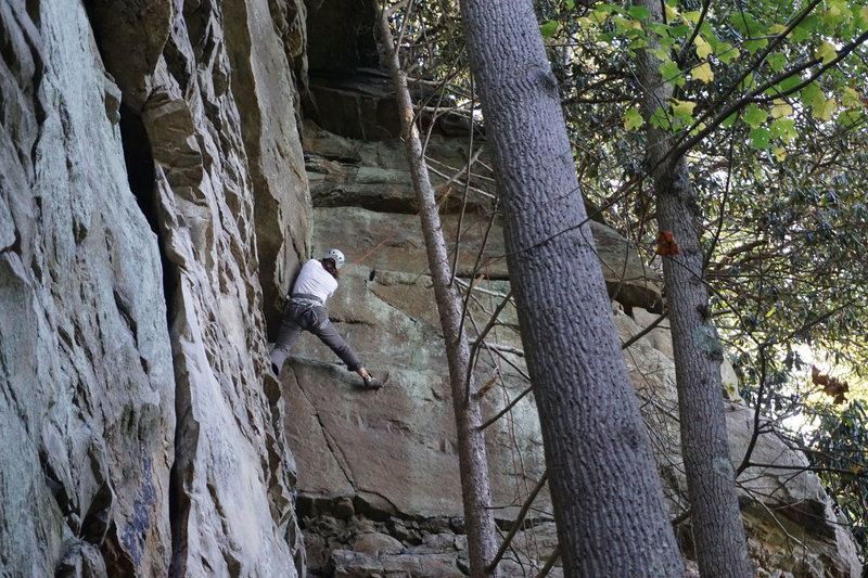 This is a top section of the route. These regions of a flat rock have small crimps and cracks and can be climbed by traversing to the corner away from the bolt line.