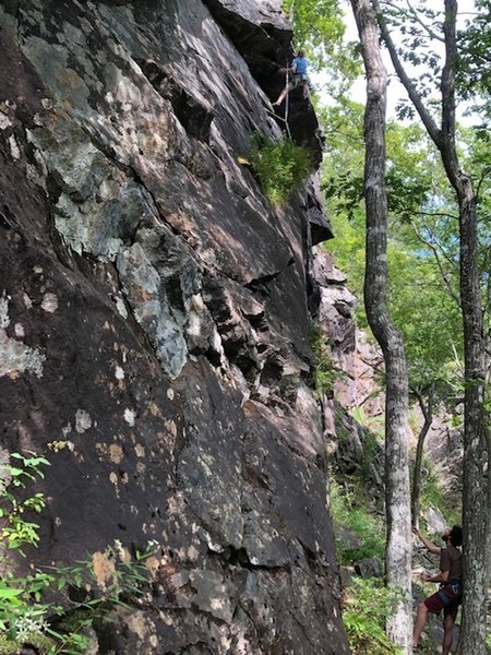Jack leading through the roof on Ladder Line. Ben Rooney belaying