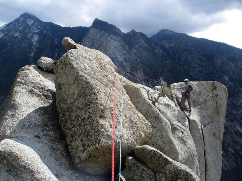 Kevin atop the W Side rapp anchors. Step left here to access the E side rapp anchors.
