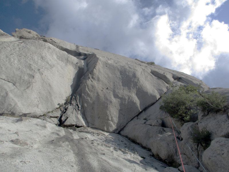 Lunch Ledge seen from the end of Indecent Exposure/S-Crack vars. S-Direct continues up the center corner, Standard Thumb comes in from the left, exits right. Might be nicer (but harder) to lieback and slab in the corner to a belay rather than...
