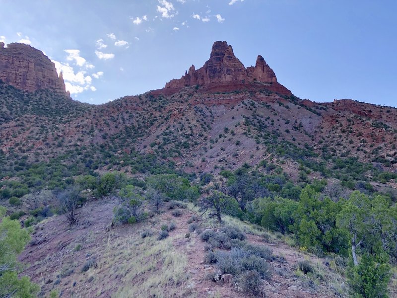 The East face. Go around the left side of the formation to reach the west face.