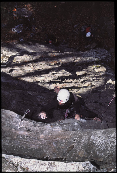 Jon Sykes making the FA of Stung in 2000. 5.11d/5.12a, 40'. Photo by Jamie Cunningham.