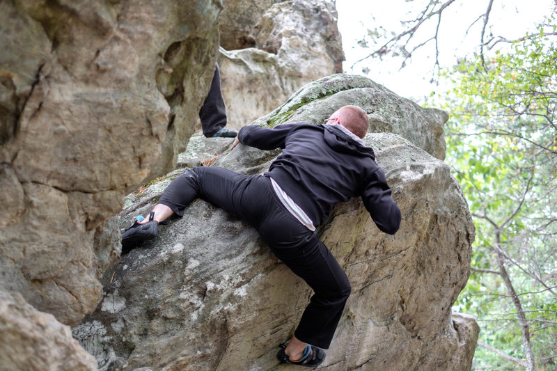 Justin demonstrates the tricky top-out. You can also top out higher up and more to the right.