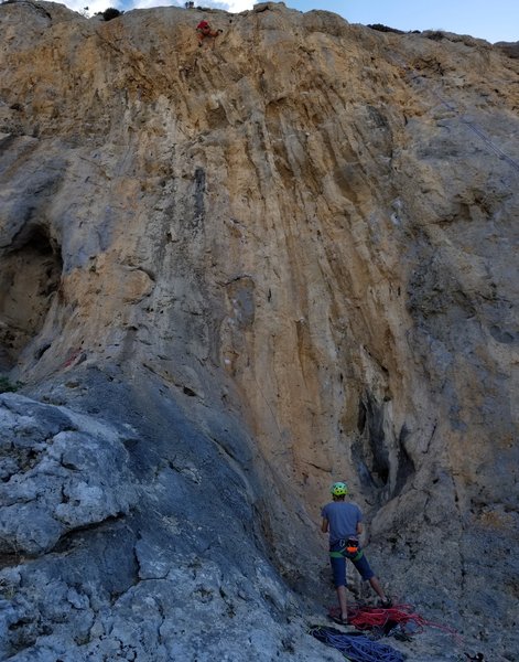 Chris pulling hard on the Crux moves just below the chains on Dionysos.