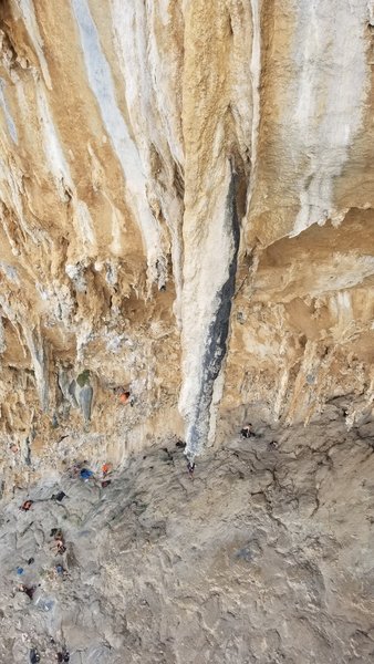 A climber searching their Way through the never ending stalactite forest of Priapos.