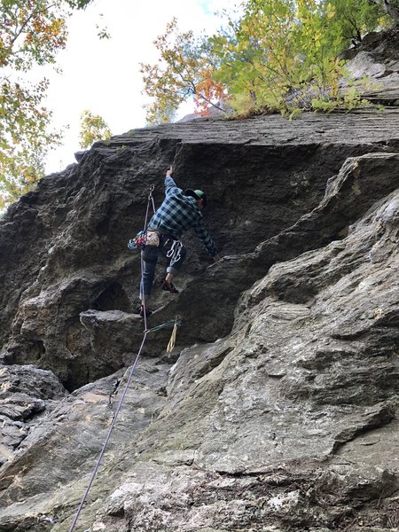 Anthony pulling the crux roof. Sweet moves!