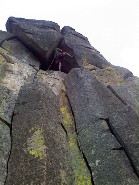 Trad climber taking a rest on lead for what looks like "Airball" or "Airball Direct".