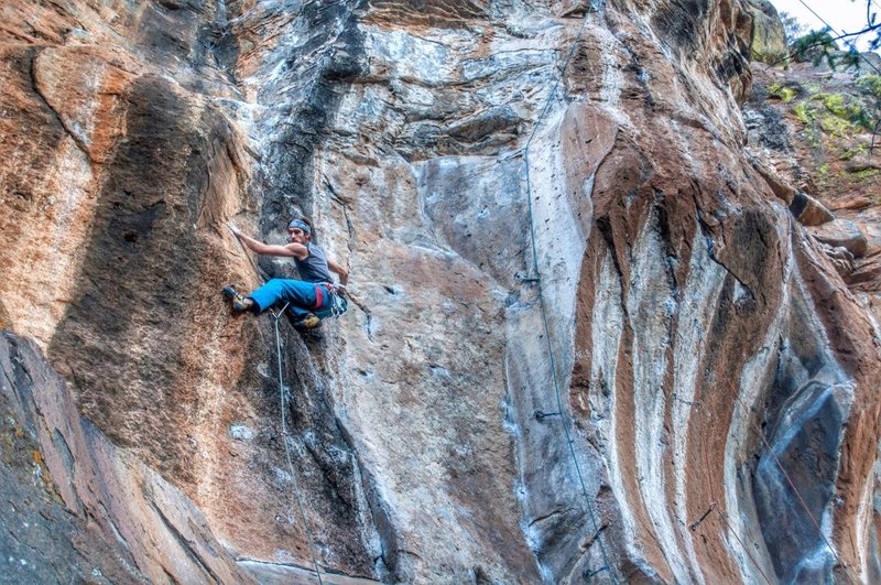 Crimping through the crux midway up Giggle Drops. The route works into the corner directly above me.