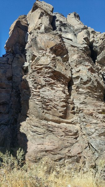 Chossy route on the arete next to the free standing pillar.