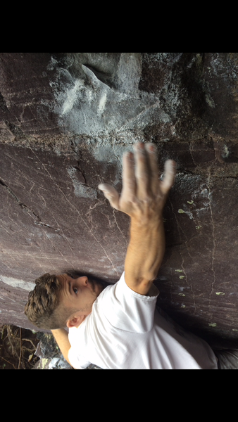 Kevin Baker reaches for the crimp on the opening move of Fire Escape.
