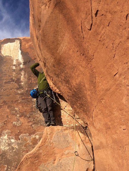 Josh- the headless climber-topping us out via the tricky, overhung OW