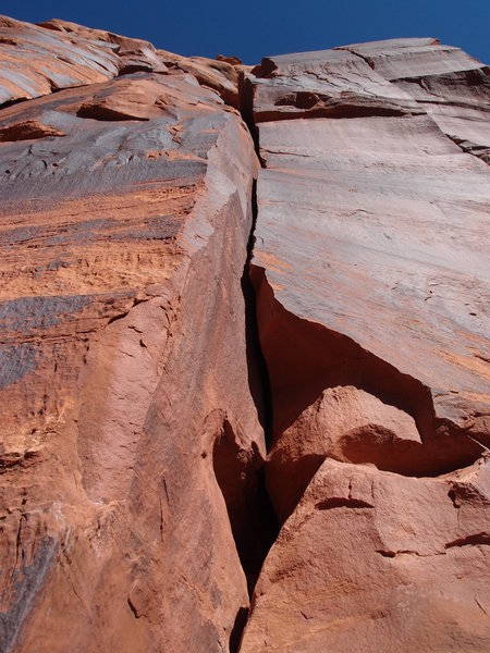Looking up at the route. A bouldery move gets you to the right facing dihedral crack, which leads to the slot.