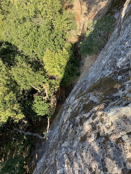 Standing atop Woodside Rock to the right of the anchors, looking down the face