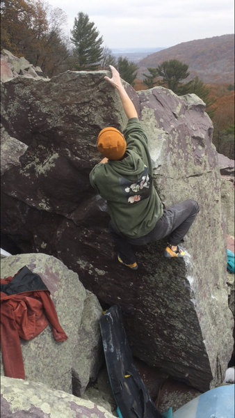 Eric Cashman climbs Pocket Protector on a snowy November day.